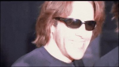 Man In Sunglasses And Black Shirt Smiling GIF