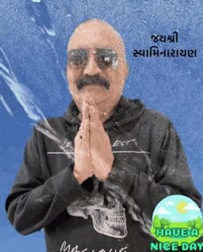 Man In Sunglasses And Black Skull Shirt Praying GIF