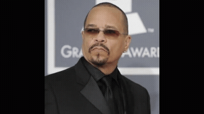 Man In Sunglasses And Black Suit In Front Of Grammy Sign GIF