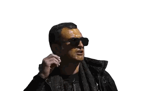 Man In Sunglasses And Black Vest Covered In Orange Paint Sticker