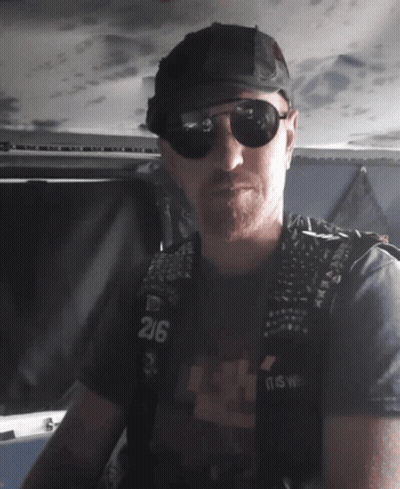 Man In Sunglasses And Black Vest Number 216 GIF