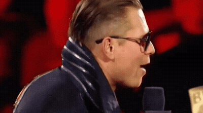 Man In Sunglasses And Blue Jacket At Microphone 13 GIF