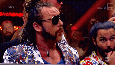 Man In Sunglasses And Colorful Jacket Watching Wrestling GIF