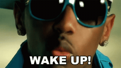 Man In Sunglasses And Earrings Saying Wake Up GIF