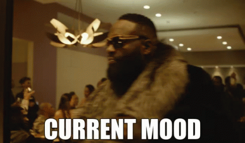 Man In Sunglasses And Fur Coat With Current Mood Above GIF