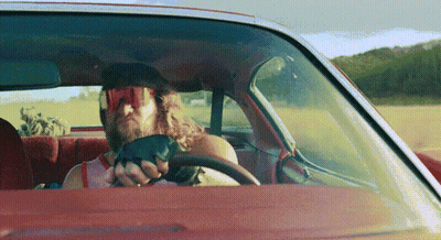 Man In Sunglasses And Gloves Driving Car GIF