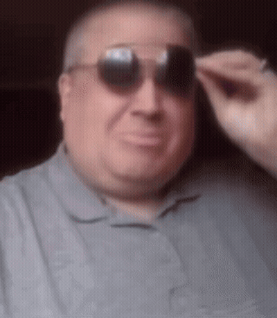 Man In Sunglasses And Grey Shirt GIF