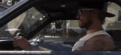 Man In Sunglasses And Hat Driving Car GIF