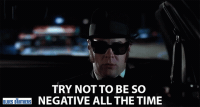 Man In Sunglasses And Hat Driving Saying Try Not To Be So Negative GIF