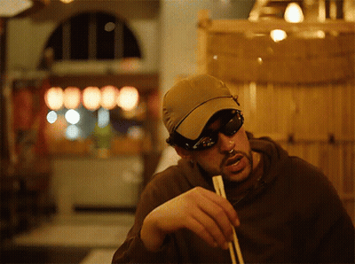 Man In Sunglasses And Hat Holding Chopsticks GIF