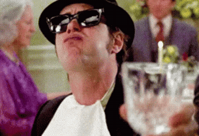 Man In Sunglasses And Hat Holding Glass GIF