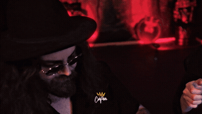 Man In Sunglasses And Hat Holding Watch With Captain Sign GIF