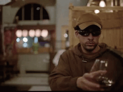 Man In Sunglasses And Hat Holding Wine GIF