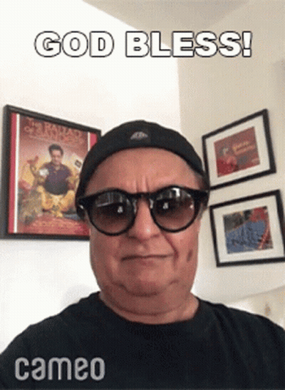 Man In Sunglasses And Hat Saying God Bless GIF