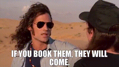 Man In Sunglasses And Hat Talking In Desert GIF
