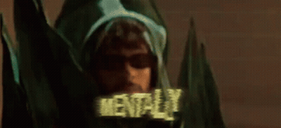 Man In Sunglasses And Hoodie Among Green Plants GIF