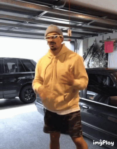 Man In Sunglasses And Hoodie Dancing In Garage GIF