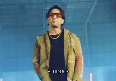 Man In Sunglasses And Jacket Saying Toree GIF