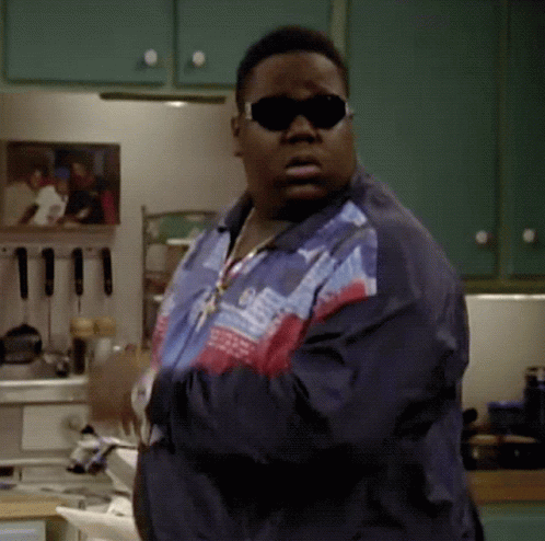Man In Sunglasses And Jacket Standing In Kitchen Arms Crossed GIF