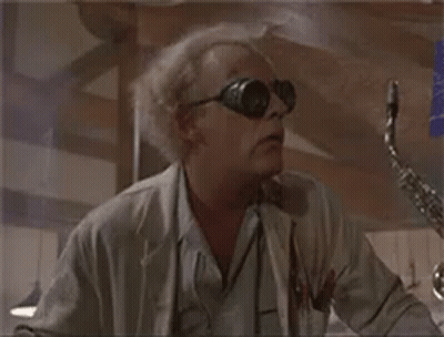 Man In Sunglasses And Lab Coat With Saxophone GIF