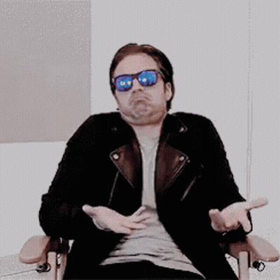 Man In Sunglasses And Leather Jacket Arms Outstretched GIF