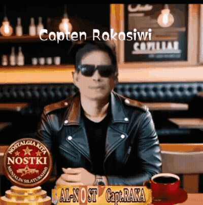 Man In Sunglasses And Leather Jacket At Table With Sign Capten Rakasiwi GIF