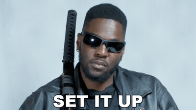 Man In Sunglasses And Leather Jacket Holding Sword Saying Set It Up GIF