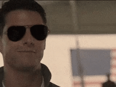 Man In Sunglasses And Leather Jacket Smiling GIF