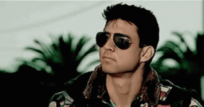 Man In Sunglasses And Leather Jacket With Palm Tree GIF