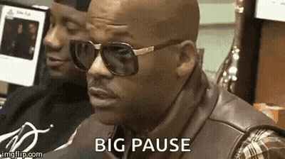 Man In Sunglasses And Leather Vest Sitting At Computer GIF
