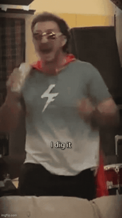 Man In Sunglasses And Lightning Bolt Shirt Dancing GIF