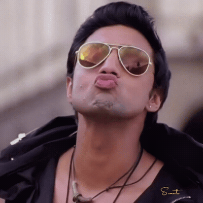 Man In Sunglasses And Necklace Making Kissing Face GIF