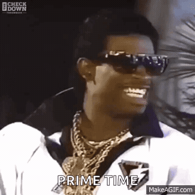 Man In Sunglasses And Necklace Smiling Says Prime Time GIF