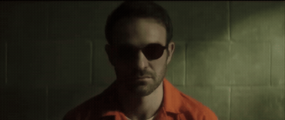 Man In Sunglasses And Orange Shirt GIF