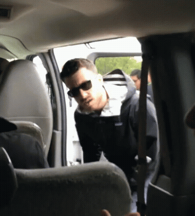 Man In Sunglasses And Patagonia Jacket Standing In Car GIF