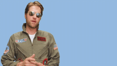Man In Sunglasses And Pilot Jacket Points To You GIF