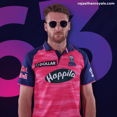 Man in Sunglasses and Pink Happilo Shirt