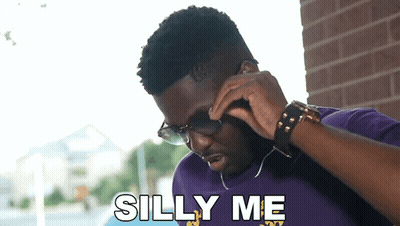 Man In Sunglasses And Purple Shirt Talking On Phone Saying Silly Me GIF
