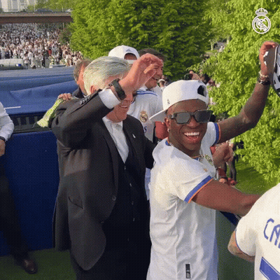 Man In Sunglasses And Real Shirt Next To Man In Suit GIF