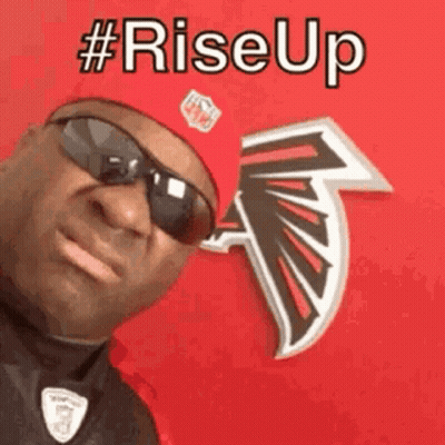 Man In Sunglasses And Red Hat In Front Of NFL Logo GIF