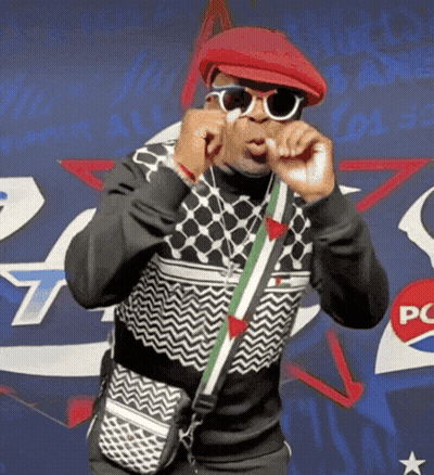 Man In Sunglasses And Red Hat In Front Of Pepsi Sign GIF