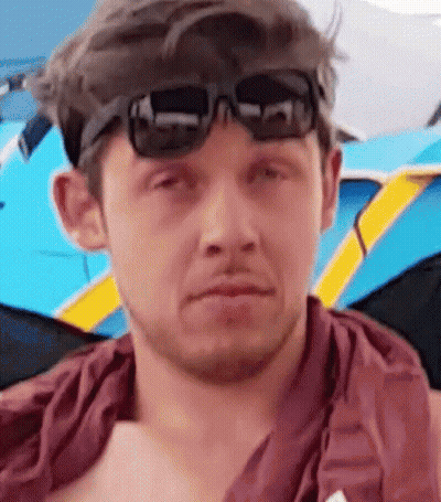Man in Sunglasses and Red Shirt Close Up