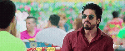 Man In Sunglasses And Red Shirt In Front Of Crowd GIF