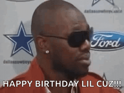 Man In Sunglasses And Red Shirt In Front Of Ford Logo GIF