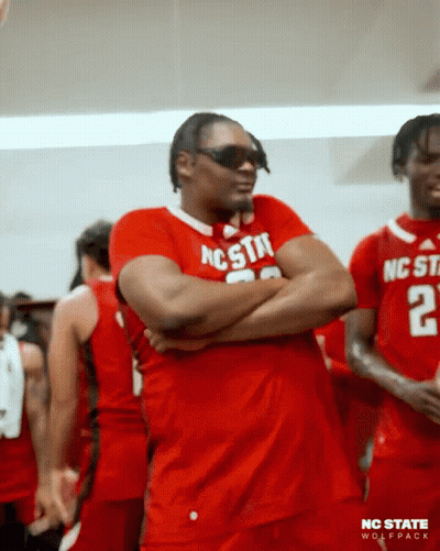 Man In Sunglasses And Red Shirt Saying NC State GIF
