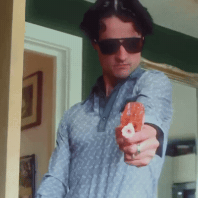 Man In Sunglasses And Ring Pointing Gun At Camera GIF
