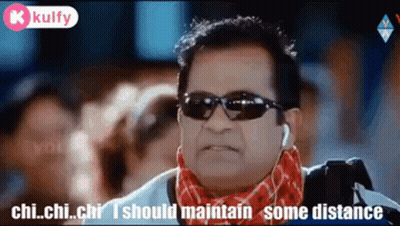 Man In Sunglasses And Scarf Talking About Distance GIF