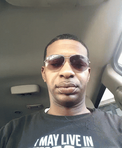 Man In Sunglasses And Shirt Saying May Live In GIF