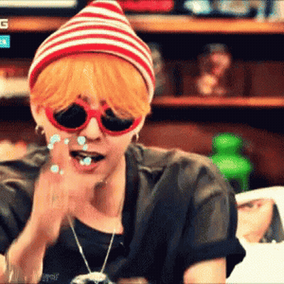 Man In Sunglasses And Striped Hat Applauding GIF