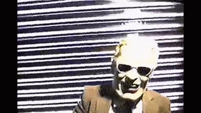 Man In Sunglasses And Suit At Black White Striped Wall GIF